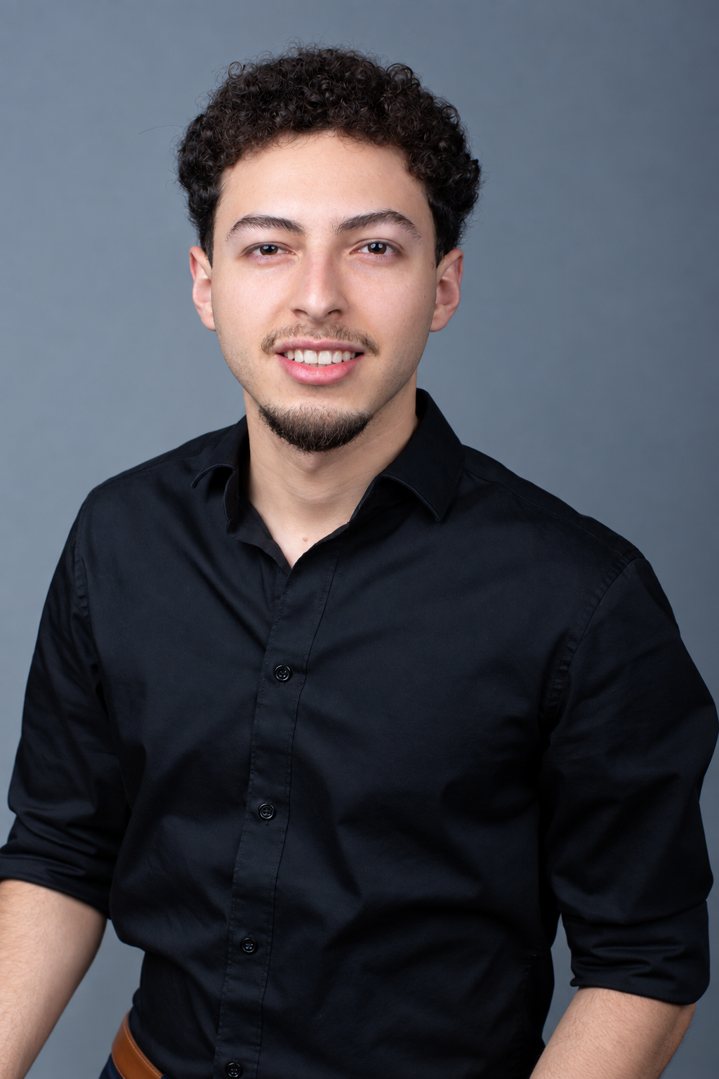 Jared Machado smiling in a black shirt